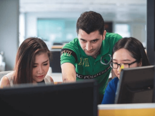 Teacher and students in computer classroom