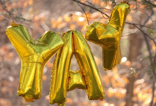 "Yay," spelled out in balloons to celebrate student success.