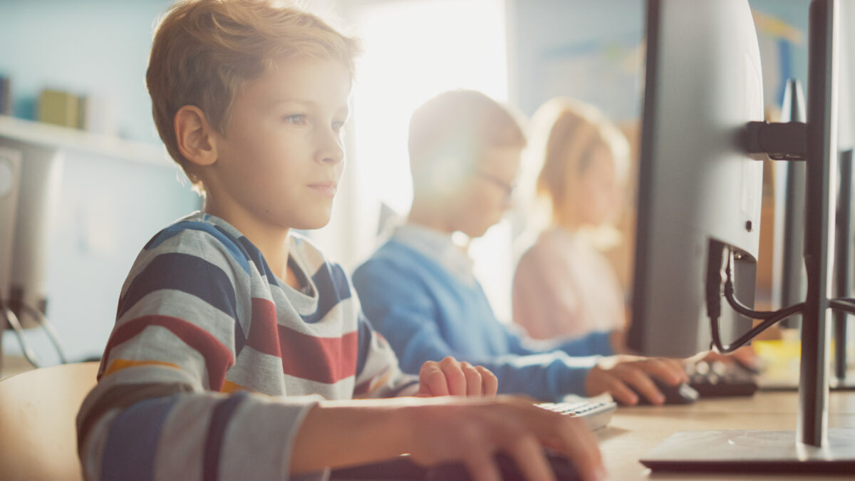 Kids happily and safely browsing the web on desktop computers